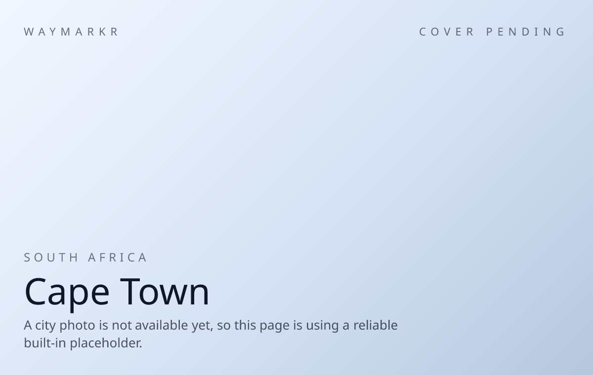 Cape Town skyline at dusk with Table Mountain behind it.