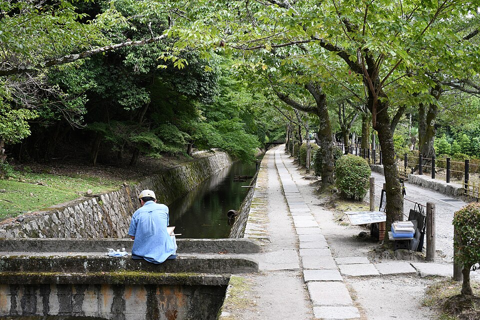 Philosopher's Path in Kyoto lined with trees and canal water
